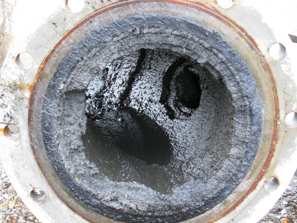 Reducing limescale in effluent water pipe of a refinery
