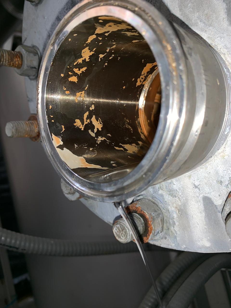 Particles of lime and corrosion found in a production system
