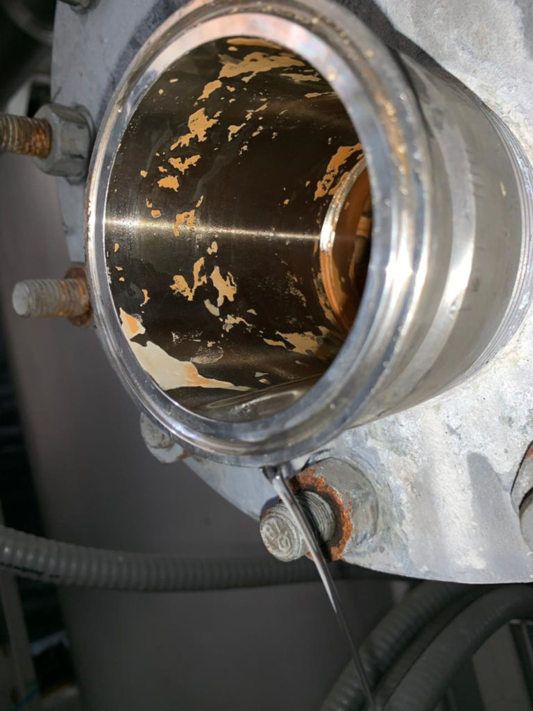 Particles of lime and corrosion found in a production system